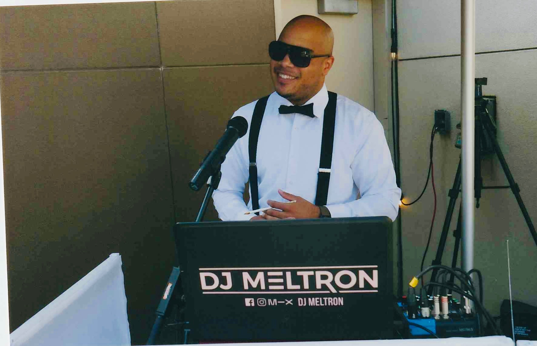 DJ Meltron performing behind his booth