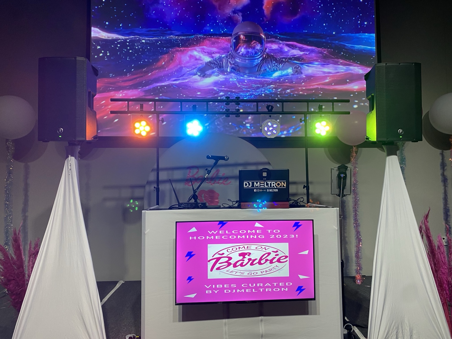 Full DJ setup with lighting and projection