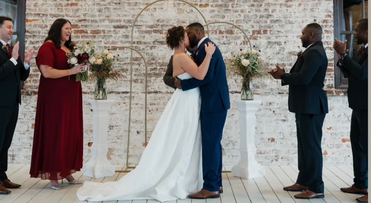 Newly married couple celebrating at their wedding